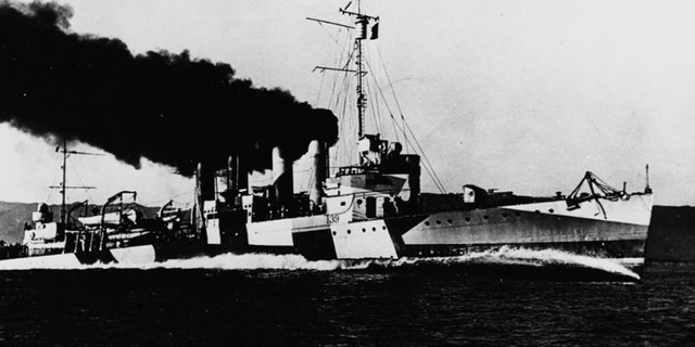The USS Ward, painted in disruptive camouflage, running speed trials off the California coast in September 1918.