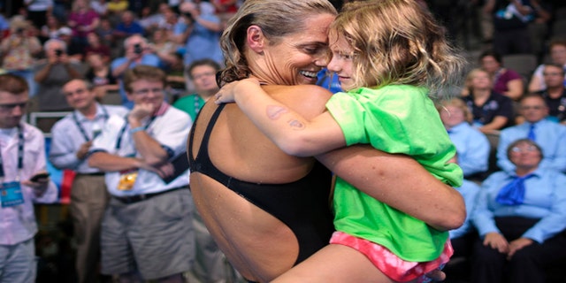 July 2, 2012: Dara Torres hugs her daughter Tessa Grace Torres-Hoffman after competing in the women's 50-meter freestyle final at the U.S. Olympic trials.