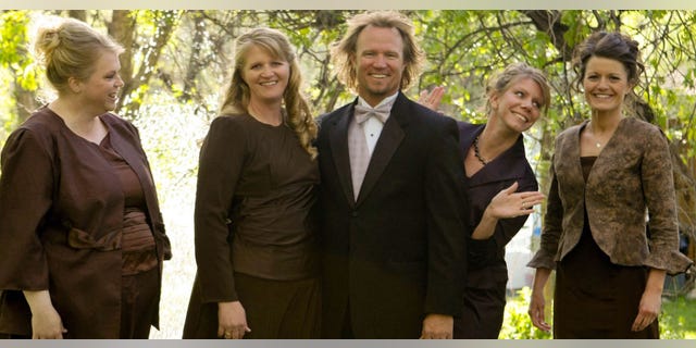 Kody Brown, center, poses with his wives, from left, Janelle, Christine, Meri, and Robyn in a promotional photo for TLC's reality TV show, 'Sister Wives.'