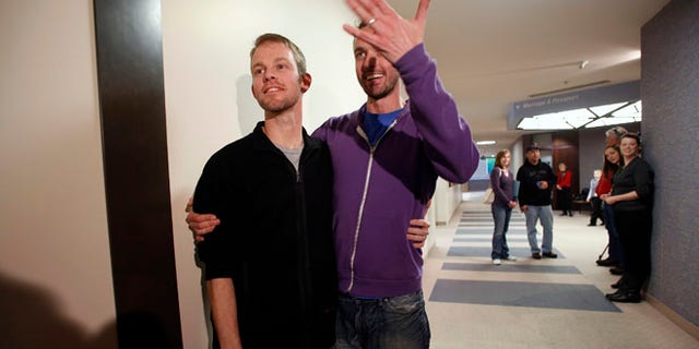 Dec. 20, 2013: The first gay couple to be married in Utah, Seth Anderson (L) and Michael Ferguson, are seen after getting married at the Salt Lake County Clerks office in Salt Lake City, Utah.
