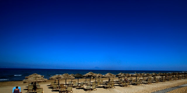 Sunbeds on the beach of the Olympia Riviera resort in the town of Killini, Greece. (REUTERS/Yannis Behrakis)