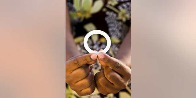 This photo provided by the International Partnership for Microbicides shows a ring that is coated with an anti-AIDS drug designed for women to insert into the vagina once a month to reduce the risk of HIV infection. Researchers say women who inserted a vaginal ring coated with an anti-AIDS drug once a month were partially protected against HIV infection. Two large studies in Africa found the effect was modest, reducing overall HIV infection by about a third. But surprisingly, the ring worked far better in women 25 and older, leaving researchers wondering if younger women who got little to no benefit simply didnt use the device properly. (Andrew Loxley/International Partnership for Microbicides via AP)