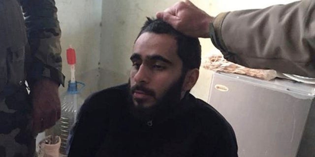 In this photo provided by the U.S. District Court, Alexandria, Va., Mohamad Khweis, 27, of Alexandria, Va., is seen. To the Kurdish peshmerga forces patrolling northern Iraq in March 2016, Khweis, appeared to be a member of the Islamic State terror group. They certainly didn't peg him as a bus driver from the wealthy suburbs of Washington. (U.S. District Court, Alexandria, Va. via AP)
