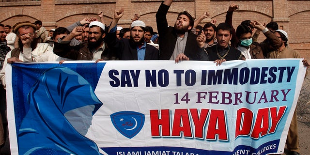 Feb. 14, 2014: Supporters of Islami Jamiat Talaba, a student wing of Pakistan's religious and political party Jamaat-e-Islami, shout slogans to condemn Valentine's Day during a protest at the University of Peshawar.