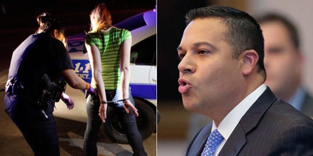 Texas state lawmaker Jason Villalba, (r.), wants to establish a "buffer zone" to keep people away from police as they do their work, as seen above, in photo of Dallas police arresting a prostitution suspect. (AP)