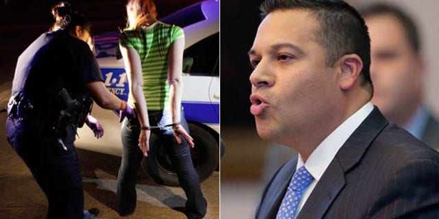 Texas state lawmaker Jason Villalba, (r.), wants to establish a "buffer zone" to keep people away from police as they do their work, as seen above, in photo of Dallas police arresting a prostitution suspect. (AP)
