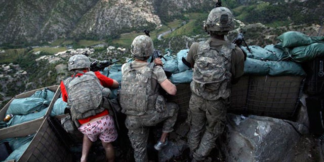 May 11 2009: U.S. soldiers responded to Taliban fire outside their bunker in Korengal Valley, Afghanistan.