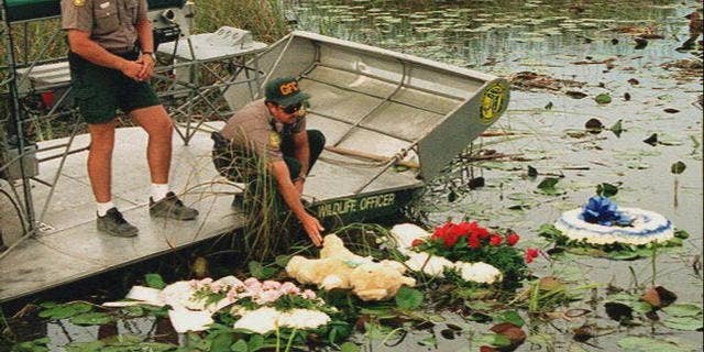 May 1996: Officers lay wreaths on the water at the site of the ValuJet Flight 592 crash.
