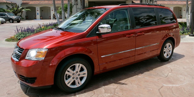 FILE - This July 17, 2007 file photo shows the 2008 Dodge Grand Caravan at the Four Seasons Hotel in Carlsbad, Calif. On Wednesday, June 18, 2014, the National Highway Traffic Safety Administration posted documents on its website detailing an investigation of about 700,000 Dodge Journey SUVs and Chrysler Town and Country and Dodge Grand Caravan minivans from the 2008 to 2010 model years. The agency wants to see if the keys can fall out of the run position under harsh roadway conditions. (AP Photo/Lenny Ignelzi, File)