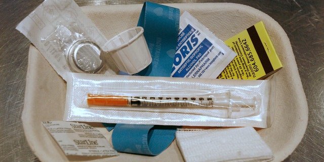 A small kit of supplies containing syringes, bandaids and antiseptic pads waits to be used by a drug addict inside a safe injection site on Vancouver, British Columbia's eastside August 23, 2006. Known as Insite the facility opened three years ago and operates legally after the federal and provincial governments gave their blessing. Inside, addicts can shoot up their own heroin or cocaine under the supervision of a nurse. The Health Canada exemption runs out Sept. 12 and Prime Minister Stephen Harper has said he's