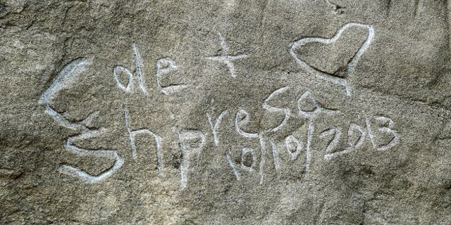 Oct.. 31, 2013: Graffito spelling "Cole & Shpresa 10/10/2013" is seen carved into the Pompeys Pillar National Monument in Montana.
