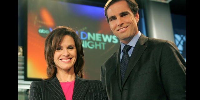 Elizabeth Vargas and Bob Woodruff pose in the studio for ABC's "World News Tonight," Monday, Dec. 5, 2005, in New York after the network's news division announced the pair would co-anchor the news show beginning Jan. 3, 2006.