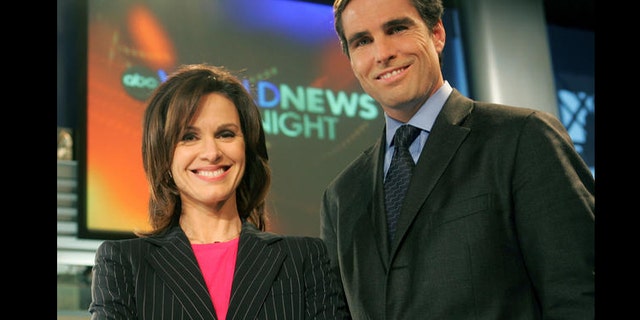 Elizabeth Vargas and Bob Woodruff pose in the studio for ABC's "World News Tonight," Monday, Dec. 5, 2005, in New York after the network's news division announced the pair would co-anchor the news show beginning Jan. 3, 2006.