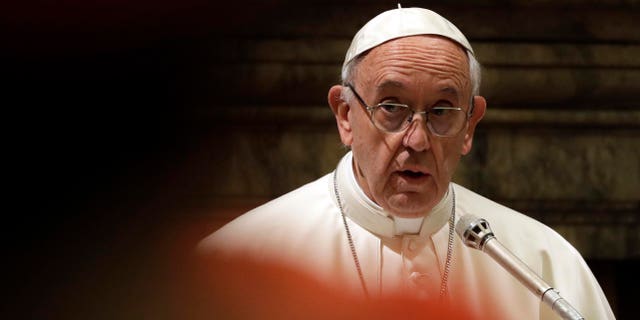 Pope Francis delivers his message to prelates on the occasion of his Christmas greetings to the Roman Curia in the Clementine Hall, at the Vatican, Thursday, Dec. 22, 2016. (AP Photo/Gregorio Borgia, Pool)