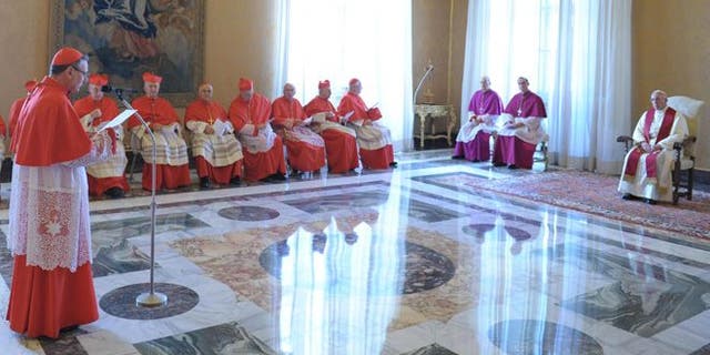 Sept. 30, 2013: In this picture provided by the Vatican newspaper L'Osservatore Romano, Pope Francis listens to a cardinal during a consistory at the Vatican. 
