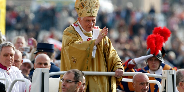 Oct. 23, 2011: Pope Benedict XVI, center, delivers his blessing as he arrives in St. Peter's square at the Vatican to celebrate a beatification mass.