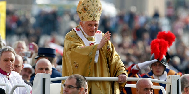 Oct. 23, 2011: Pope Benedict XVI, center, delivers his blessing as he arrives in St. Peter's square at the Vatican to celebrate a beatification mass.