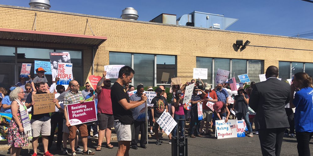 Pro-immigrant protesters gathered outside the immigration detention facility as the congressmen banged on the door to gain access.