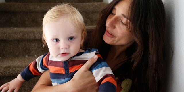Oct. 20, 2016: In this photo, vegan mother Fulvia Serra holds her 1-year-old son Sebastiano.