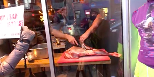 A chef at Toronto's Antler Kitchen and Bar responded to a demonstration outside his eatery by slicing up a piece of meat in full view of protesters.