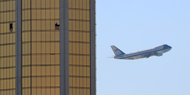 Oct. 4, 2017: Air Force One departs Las Vegas past the broken windows on the Mandalay Bay hotel, where Stephen Paddock carried out his mass shooting along the Las Vegas Strip.