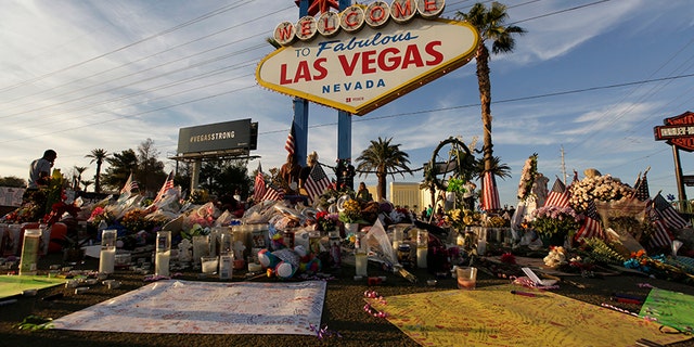 People visit a makeshift memorial on Oct. 16 for victims of the mass shooting in Las Vegas.