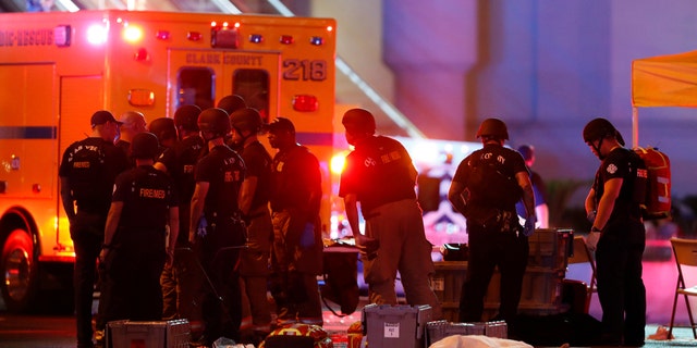 ATTENTION EDITORS - VISUAL COVERAGE OF SCENES OF INJURY OR DEATH A body is covered with a sheet in the intersection of Tropicana Avenue and Las Vegas Boulevard South after a mass shooting at a music festival on the Las Vegas Strip in Las Vegas, Nevada, U.S. October 1, 2017. REUTERS/Las Vegas Sun/Steve Marcus - RC14603A6AA0