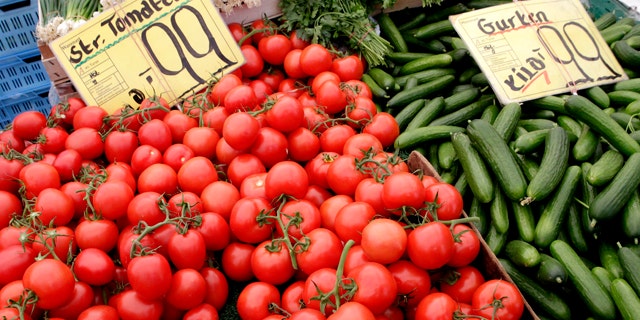 June 3: Tomatoes and cucumbers from Holland are displayed for sale at a market in Berlin, Germany. Nearly 200 new cases of E. coli infection were reported in Germany in the first two days of June, the national disease control center reported Friday, but officials say there are signs the European bacterial outbreak that has killed 18 people could be slowing.