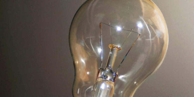 An illustration picture shows an incandescent electric bulb in a private home in Bordeaux, soutwestern France, December 19, 2012. French electricity tariffs will rise by an average of 2.5 percent on January 1, 2013 the government said on Wednesday, despite a call by France's energy regulator for a higher increase. REUTERS/Regis Duvignau (FRANCE - Tags: ENERGY) - RTR3BQU4