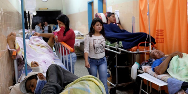 Patients lie on beds in an aisle of the emergency room at the University Hospital in Merida, Venezuela June 17, 2016. Picture taken June 17, 2016.