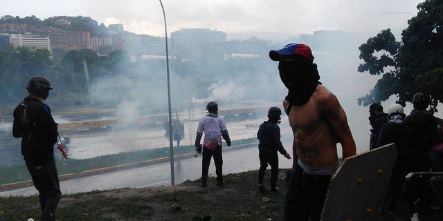 Riot in the main highway of Caracas after a demonstration against Nicolas Maduro