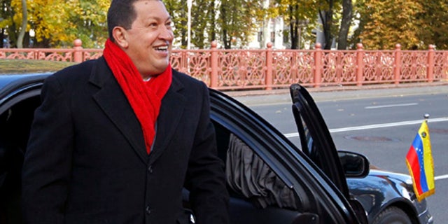 Venezuelan President Hugo Chavez arrives to meet his Belarusian counterpart in Minsk, Belarus Saturday Oct. 16, 2010. Chavez will meet with his Belarusian counterpart Alexander Lukashenko in Minks on Saturday to discuss trade and economic relations between the two countries. Chavez flew to the Belarusian capital from Moscow as part of his international tour, which also includes Ukraine and Iran. (AP Photo//Vasily Fedosenko, Pool)