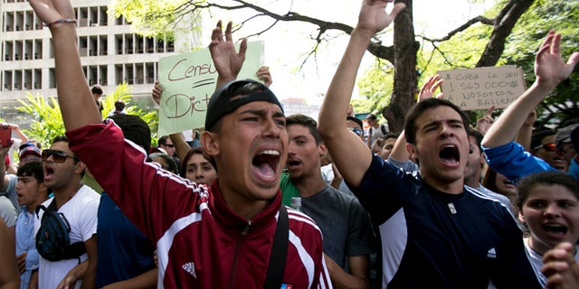 Feb. 17, 2014: Students shout slogans against Venezuela's President Nicolas Maduro during a march to Venezuelan Telecommunications Regulator Office or CONATEL in Caracas, Venezuela.
