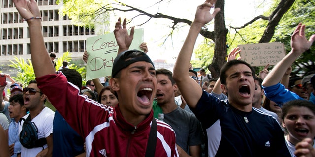 Feb. 17, 2014: Students shout slogans against Venezuela's President Nicolas Maduro during a march to Venezuelan Telecommunications Regulator Office or CONATEL in Caracas, Venezuela.