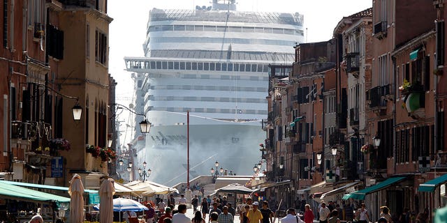 A cruise ship in Venice lagoon is seen looming over the city's streets in this 2017 photo.
