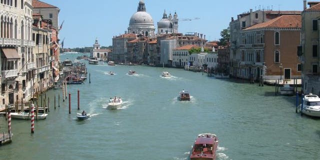 July 17, 2012: Water traffic bustling on the Grande Canale in the heart of Venice, Italy.