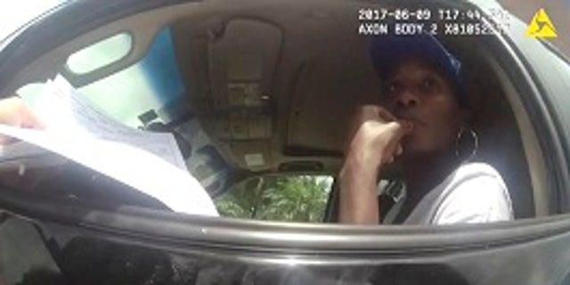 RETRANSMISSION TO CORRECT NAME TO POLICE OFFICER DAVID DOWLING - This photo taken from a body camera on June 9, 2017, shows tennis star Venus Williams listening to Palm Beach Gardens Police Officer David Dowling following a car crash in Palm Beach Gardens, Fla. The crash fatally injured an elderly man. Palm Beach Gardens police say the investigation remains open and no fault has been assigned. The estate of the man killed filed a wrongful death lawsuit against Williams on June 30. (Palm Beach Gardens Police Department via AP)