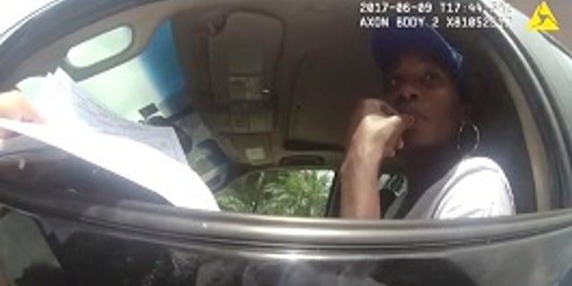 RETRANSMISSION TO CORRECT NAME TO POLICE OFFICER DAVID DOWLING - This photo taken from a body camera on June 9, 2017, shows tennis star Venus Williams listening to Palm Beach Gardens Police Officer David Dowling following a car crash in Palm Beach Gardens, Fla. The crash fatally injured an elderly man. Palm Beach Gardens police say the investigation remains open and no fault has been assigned. The estate of the man killed filed a wrongful death lawsuit against Williams on June 30. (Palm Beach Gardens Police Department via AP)