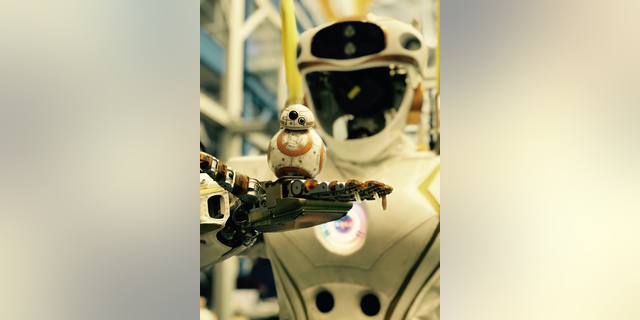 NASA's Valkyrie robot holds a little "Star Wars" BB-8.