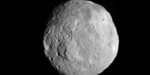 NASA's Dawn spacecraft snapped this photo of the huge asteroid Vesta on July 9, 2011. It was taken from a distance of about 26,000 miles (41,000 kilometers) away from Vesta.