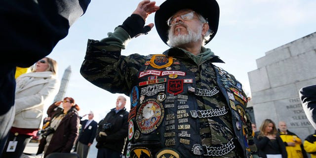 Vietnam veteran Paul Troop honors his fallen comrades while at the World War II Memorial on Veterans Day in Washington, D.C., on Nov. 11, 2013.