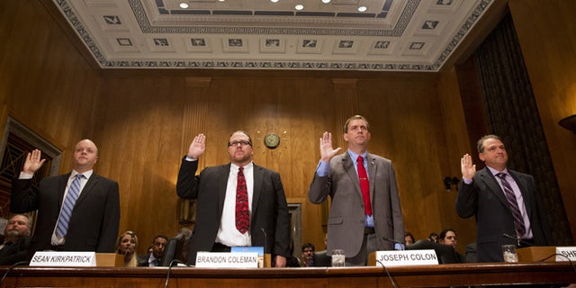 Sept. 22, 2015: From left, Sean Kirkpatrick of Chicago; Phoenix VA Health Care System Addiction Therapist Dr Brandon Coleman; VA Caribbean Healthcare System Credentialing Program Support Joseph Colon, and Overton Brooks VA Medical Center Licensed Clinical Social Worker Shea Wilkes are sworn on Capitol Hill in Washington, prior to testifying before the Senate Homeland Security and Governmental Affairs Committee hearing on "Improving VA Accountability: Examining First-Hand Accounts of Department of Veterans Affairs Whistleblowers." (AP)