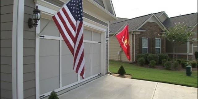 UNDATED: Marine Captain Jim Lowe has been told to take down either his American or Marine Corps flags that are displayed outside his home in an adult residential community in Griffin, Georgia.