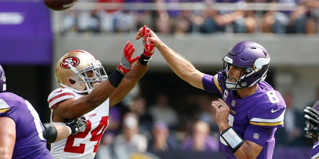 Minnesota Vikings quarterback Kirk Cousins (8) throws a pass over San Francisco 49ers defensive back K'Waun Williams (24) during the first half of an NFL football game, Sunday, Sept. 9, 2018, in Minneapolis. (AP Photo/Bruce Kluckhohn)