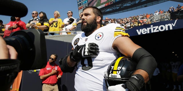 Pittsburgh Steelers offensive tackle and former Army Ranger Alejandro Villanueva (78) stands outside the tunnel alone during the National Anthem before an NFL game against the Chicago Bears Sunday, Sept. 24 in Chicago.