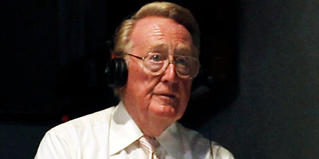 July 8, 2011: Los Angeles Dodgers sportscaster Vin Scully works in the press box as the New York Mets play against the Los Angeles Dodgers