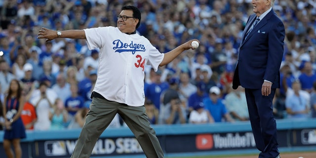 Vin Scully and Fernando Valenzuela throw out the ceremonial first pitch before Game 2 of baseball's World Series between the Houston Astros and the Los Angeles Dodgers Wednesday, Oct. 25, 2017, in Los Angeles. (AP Photo/David J. Phillip)