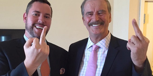 Former Mexican President Vicente Fox (right) makes an obscene gesture to Donald Trump after appearing on the Kickass Politics podcast with host Ben Mathis.