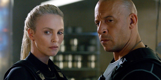 This image released by Universal Pictures shows Charlize Theron, left, and Vin Diesel in 'The Fate of the Furious.' (Universal Pictures via AP)