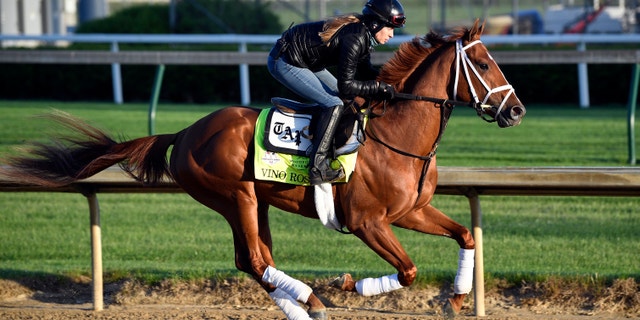 Exercise rider Adelle Bellinger works out Kentucky Derby hopeful Vino Rosso at Churchill Downs.
